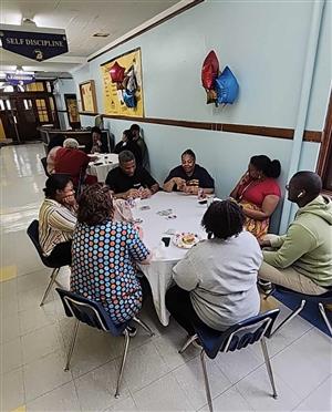 Teachers eating and playing cards