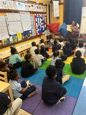 1ST Graders listens to a guest reader