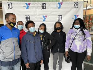 Students pose in front of the YMCA backdrop