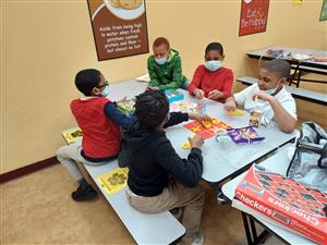 Boys playing games at lunch