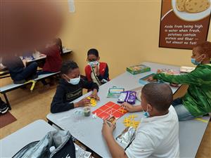 Boys playing games at lunch