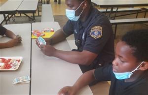 Officer Lewis Play Uno with students