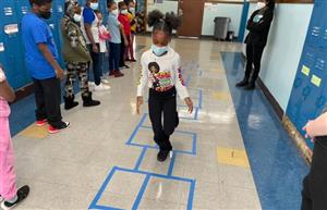 Student playing Hopscotch