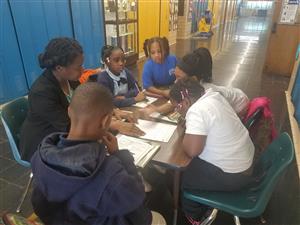  AP Ingram working with a small group of students