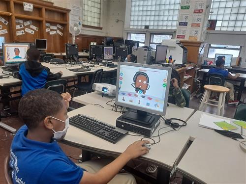 students creating digital self portraits