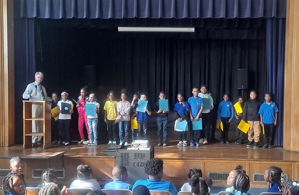  Student on stage with certificates