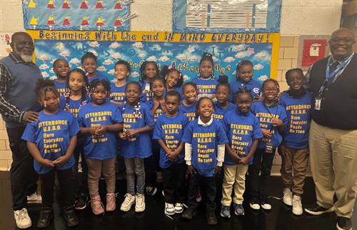  Group of students in their new attendance shirts from being at school every day this year.