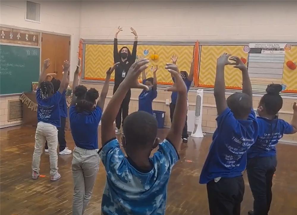 Students doing ballet moves