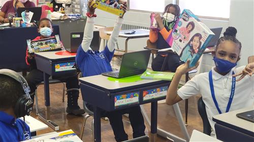 Students holding their gifts