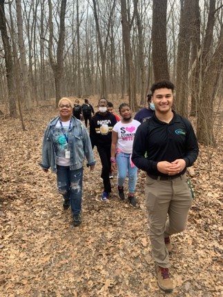  students hiking in woods