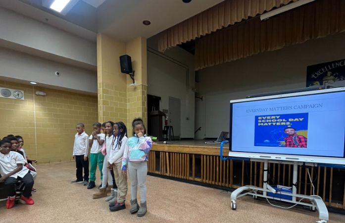  Students demonstrate in front of smart board at assembly