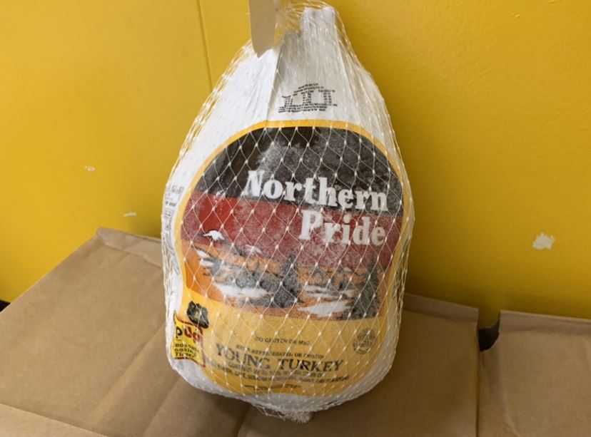 A picture of a frozen turkey.