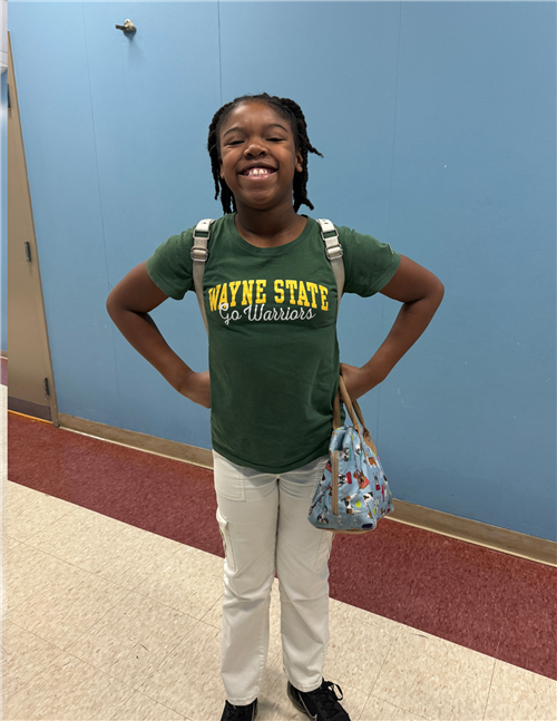 teen girl wearing wayne state university tshirt