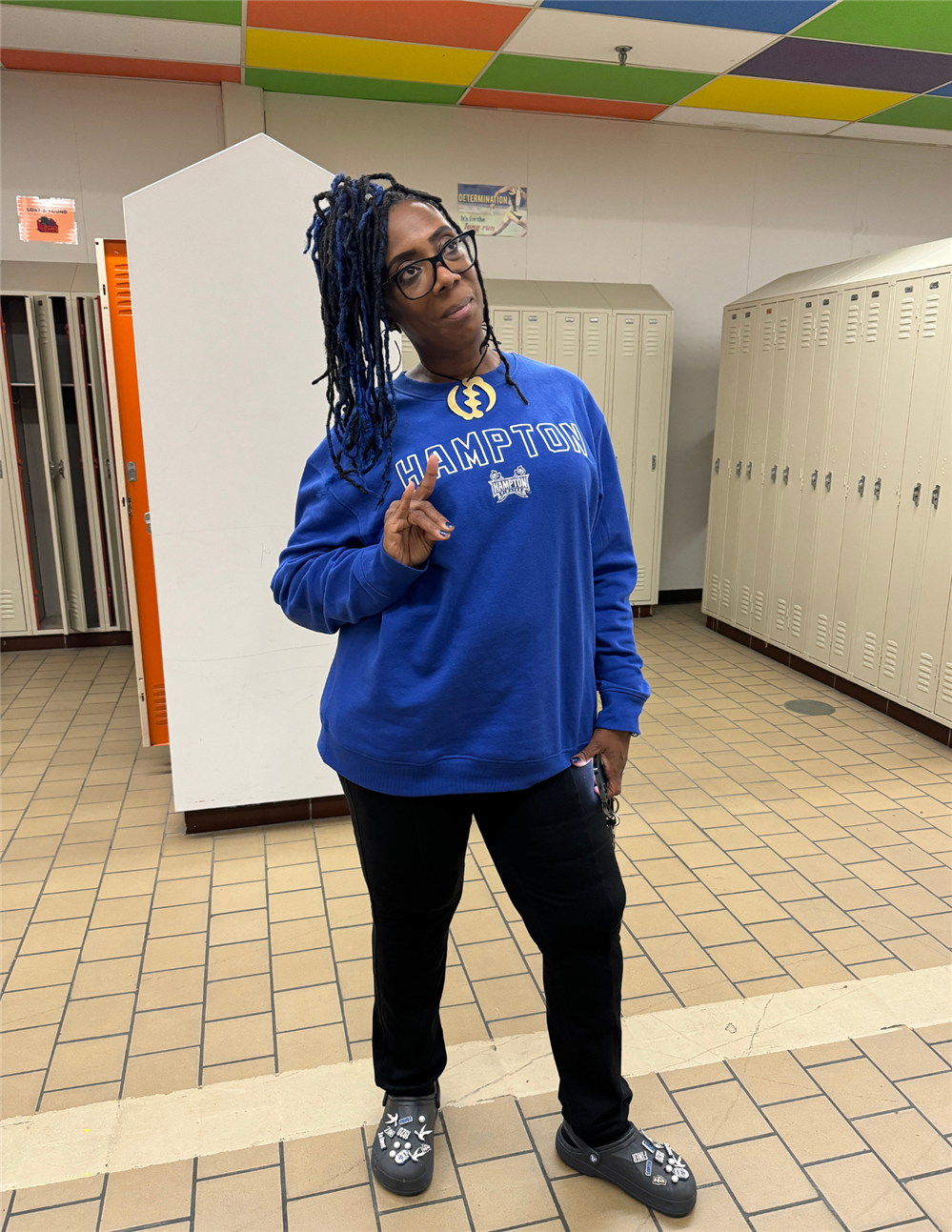 woman wearing blue hampton university sweater