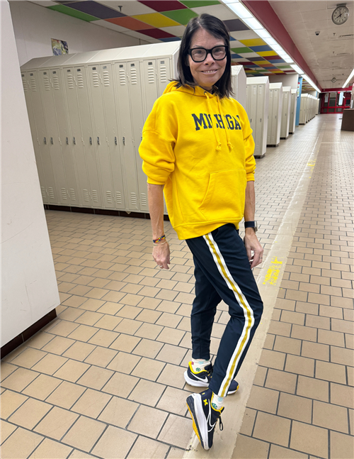woman wearing u of m hoodie and jogging pants