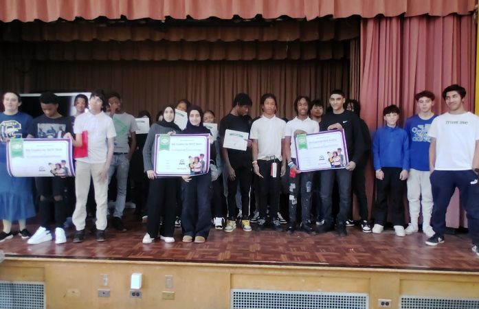  8th graders celebrating iReady success on the stage