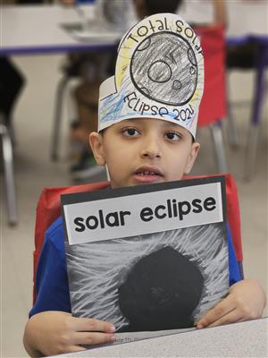 Student with solar eclipse activities