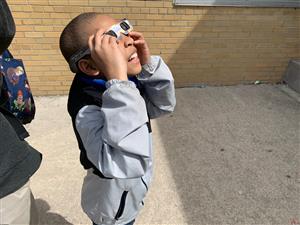 Student viewing the eclipse
