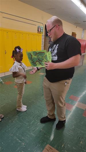 Mr. Conley with an elementary student