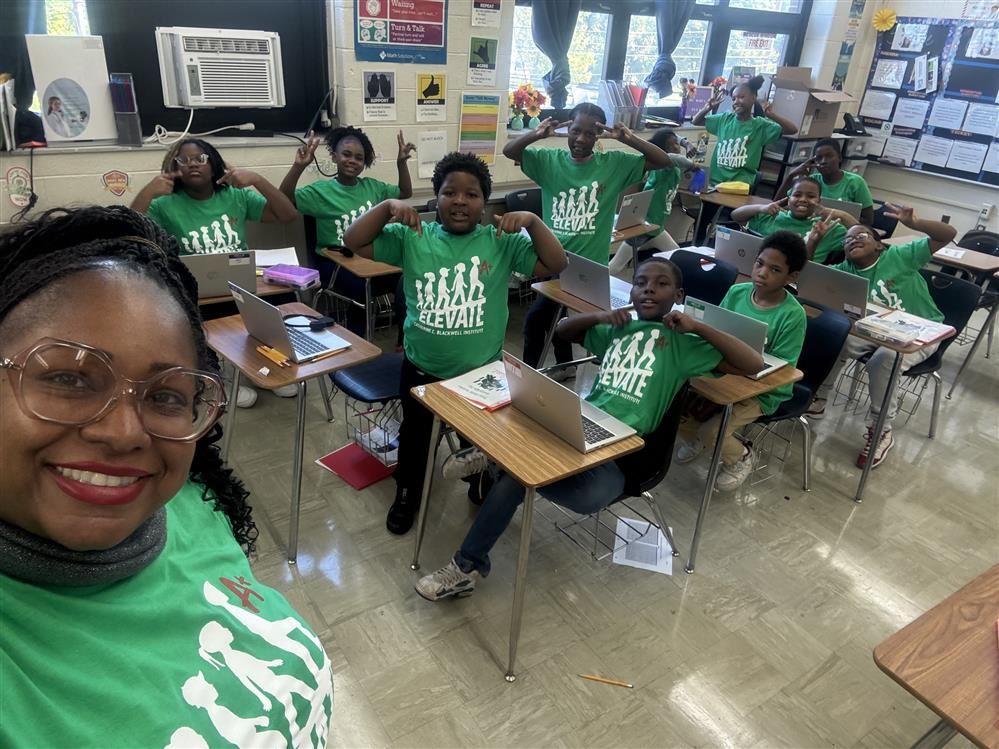  Students wearing their matching elevate shirts.
