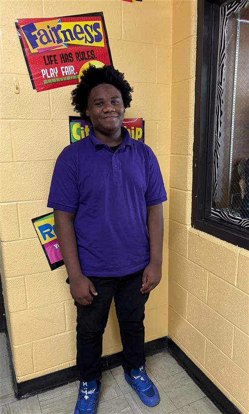 boy standing and smiling 