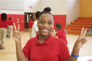 Student signing the word "peace"