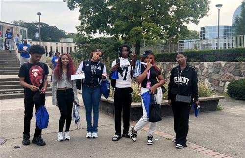  6 students standing in front of tree