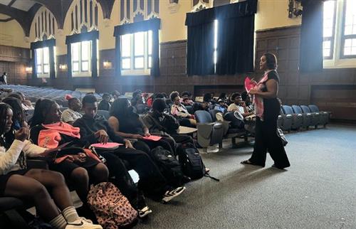  A woman talking to students in a room