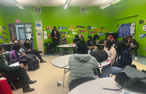  A man speaking to students in the classroom about college opportunities