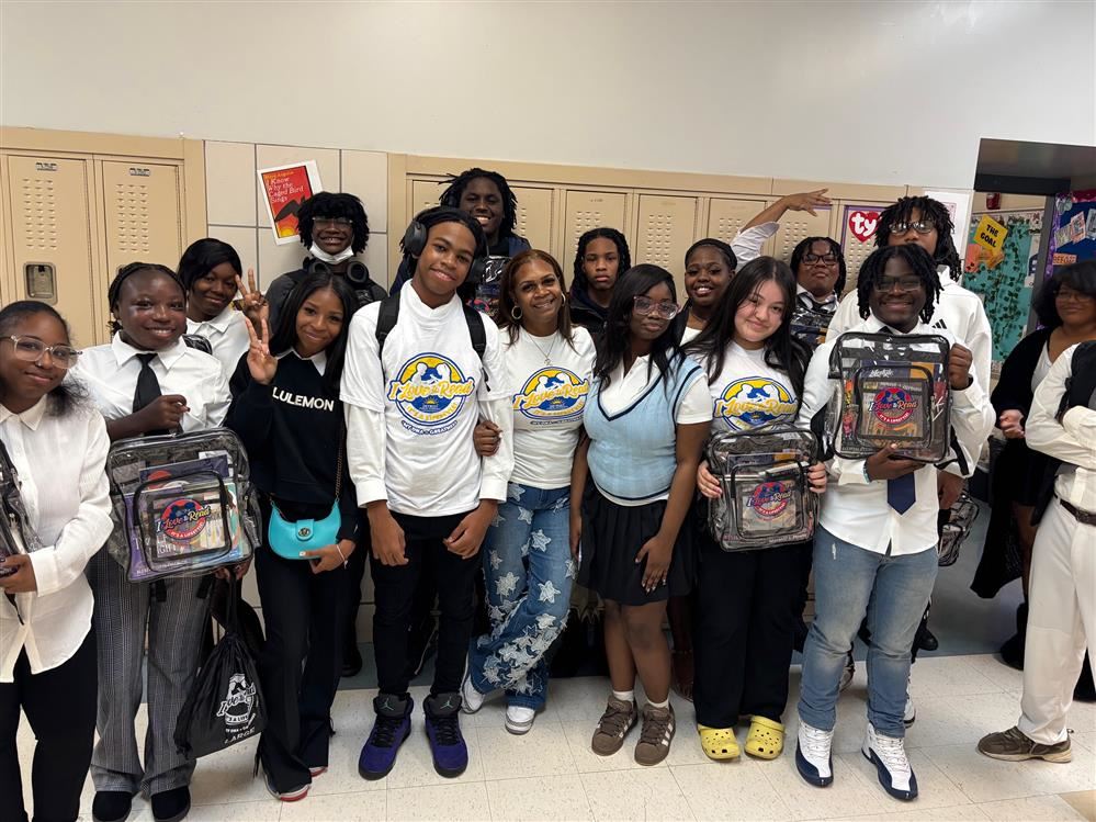  Students wearing their reading tickets with backpacks