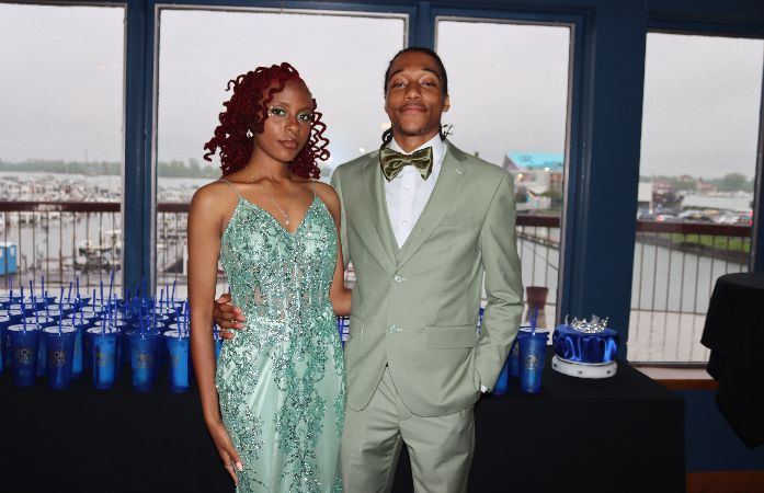  A girl and boy with the color green on