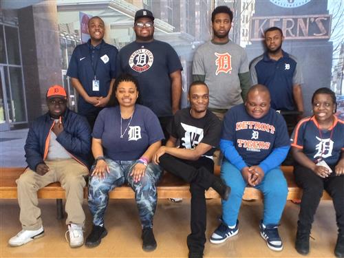 staff posing with tigers gear