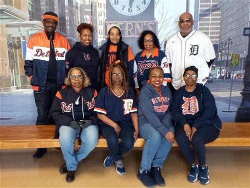 staff posing with tigers gear