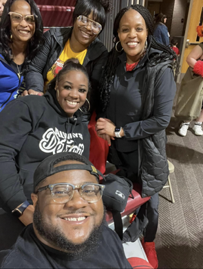 staff posing at a game