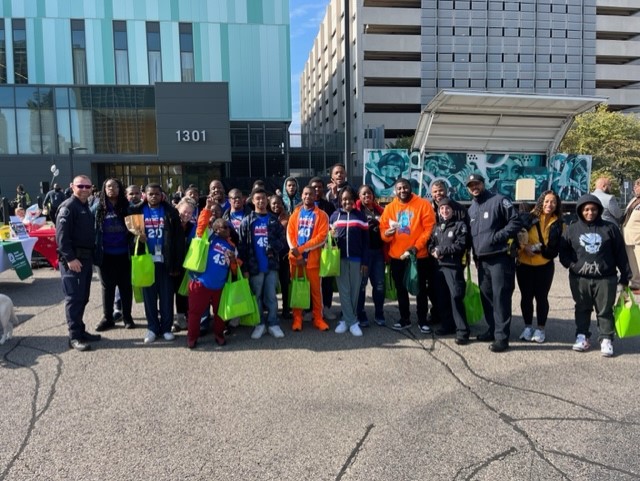 A group of students wearing orange