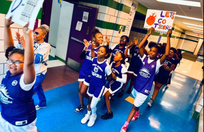  Girl's Basketball players and coach start their parade