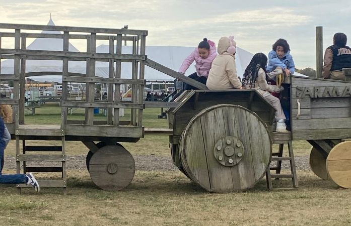  Students on a wooden tractor