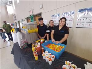 sponsors serving fruity treats 