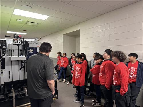 students admiring a zamboni
