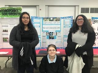 Vanessa Ruiz, Faith Brown, and Ingrid Ramos with their "Diving into Watersheds" science fair project.  