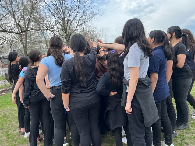  students standing together in a circle