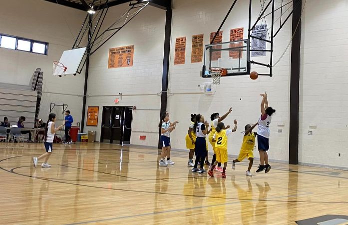  students playing basketball