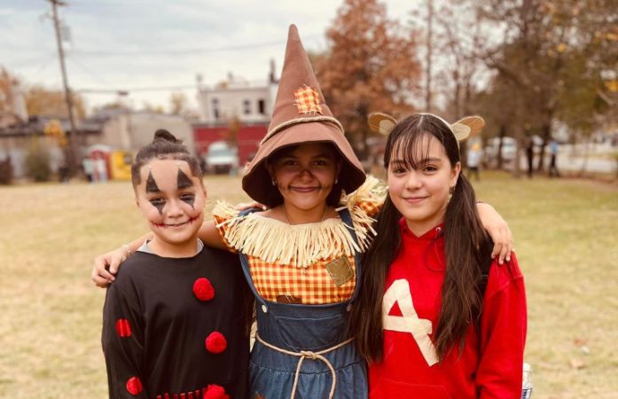  3 students in costume standing together