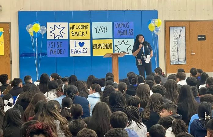  principal escamilla speaking to a group of students