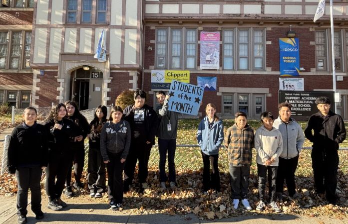  students of the month standing outside the Clippert building