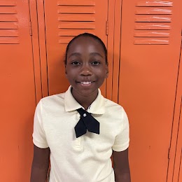 4th grade student smiling at camera