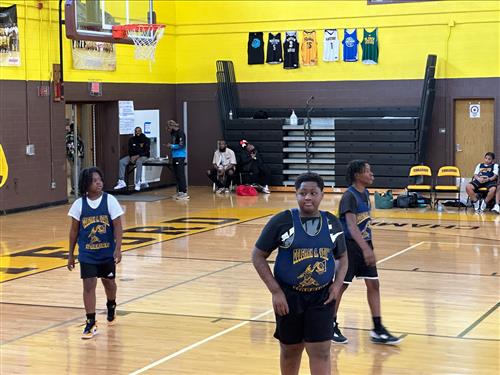 students playing basketball