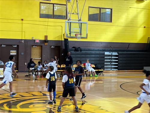 students playing basketball