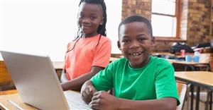 kids at laptop smiling