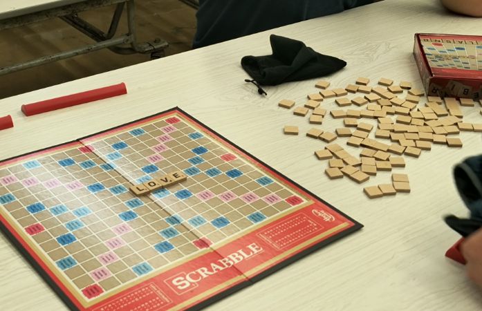 scrabble board game with the word love on it